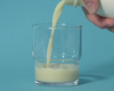 Oat Milk being poured in a glass